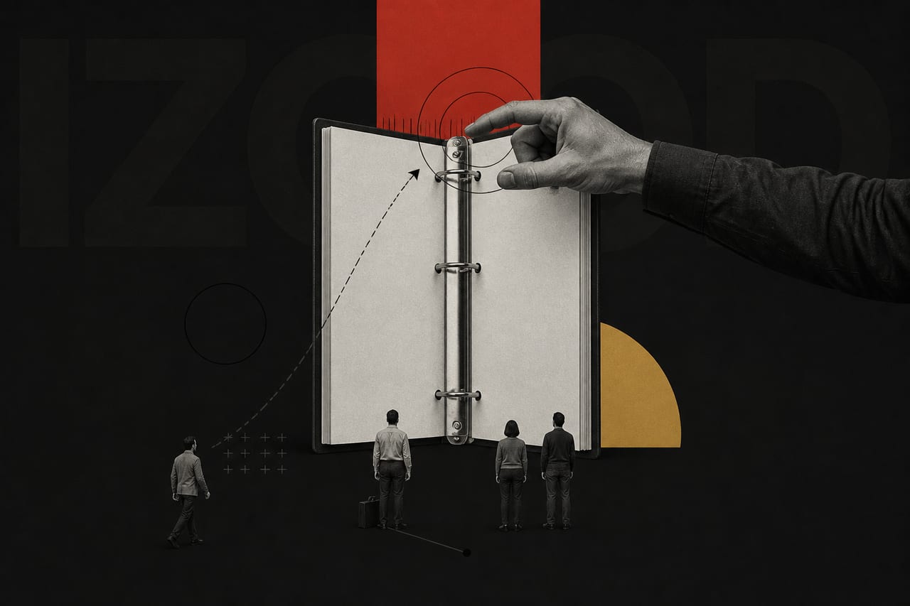 An enormous black-and-white photograph of an open ring-binder stands upright in
the middle of the frame, scaled as though it were a wall.